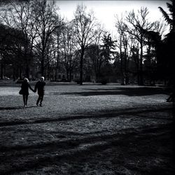 Full length of woman walking on road