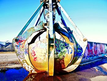 Close-up of multi colored water against blue sky