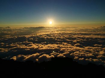 Sun shining through clouds