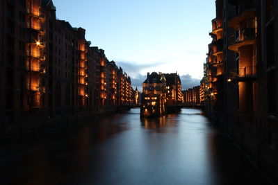 Illuminated buildings in city at night