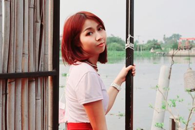 Portrait of beautiful young woman looking away