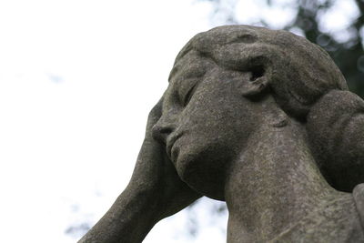 Low angle view of statue against sky