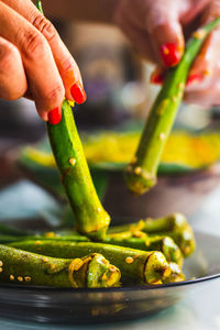 Cropped hand of person preparing food