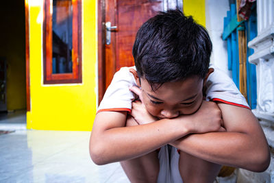 Portrait of boy in building