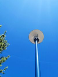 Low angle view of street light against clear blue sky