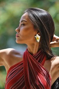 Close-up of young woman whit earring 