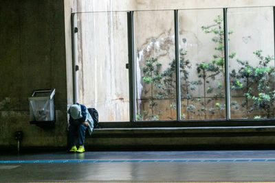 Man standing by window
