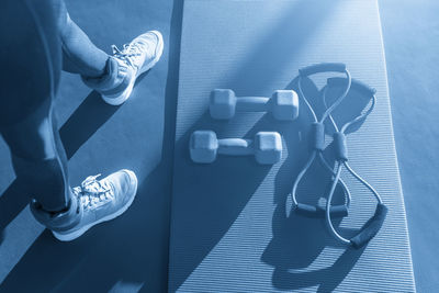 Low section of woman exercising in gym