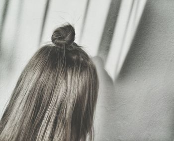 Close-up of woman with hair bun