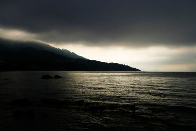 Scenic view of sea against sky at dusk