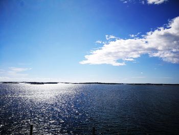 Scenic view of sea against blue sky
