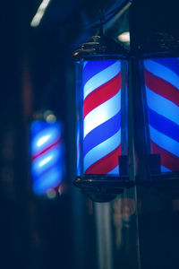 Low angle view of illuminated sign at night