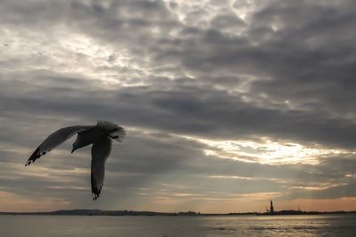 Scenic view of sea against cloudy sky