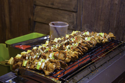 High angle view of meat on barbecue grill