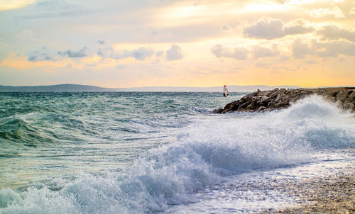 Scenic view of sea against sky during sunset