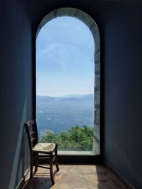 Scenic view of mountains seen through window