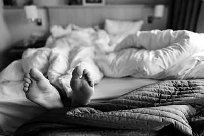 Close-up of baby sleeping on bed