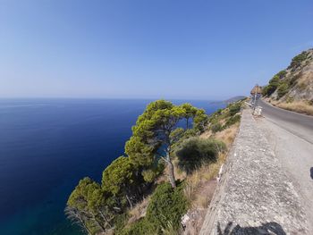 Scenic view of sea against clear blue sky