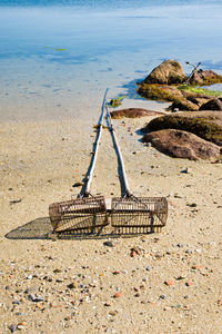View of wicker basket on rock at beach
