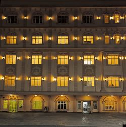 Illuminated buildings in city at night