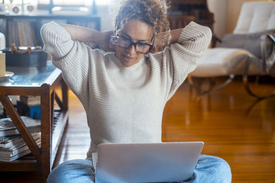 Young man using digital tablet while sitting at home