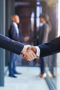 Cropped image of business people shaking hands