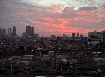 Cityscape against sky during sunset