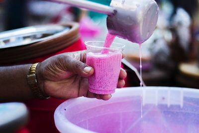 Close-up of hand holding drink