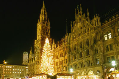 Low angle view of illuminated building at night