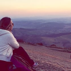 Woman on landscape at sunset