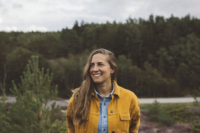 Smiling woman looking away