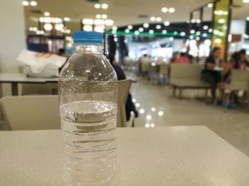 Close-up of glass bottle on table