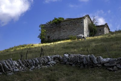 Low angle view of old ruins against sky