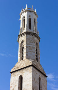 Low angle view of historic building against clear blue sky