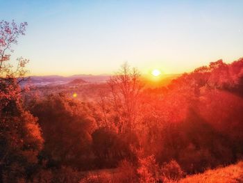 Scenic view of landscape against sky during sunset