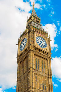 Low angle view of clock tower against sky