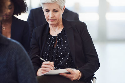 Midsection of a woman holding hands