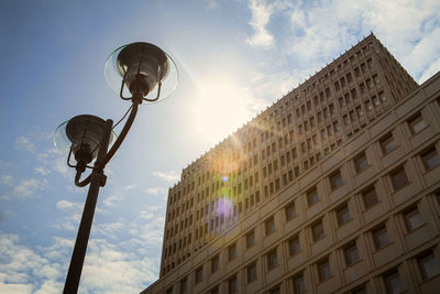 Low angle view of street light against building
