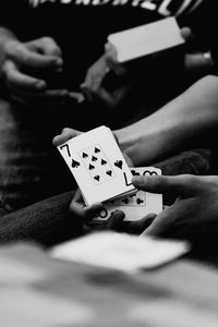 Close-up of hand playing piano