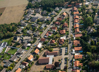 Aerial view of a german suburb with two streets and many small houses for families