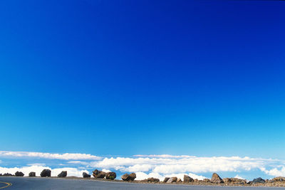 Scenic view of land against clear blue sky