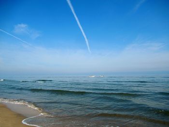 Scenic view of sea against blue sky