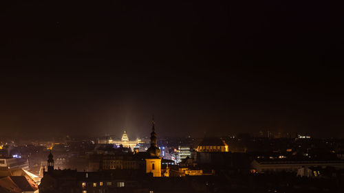 High angle view of illuminated buildings in city at night