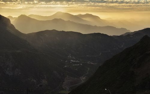 Scenic view of mountains against sky during sunset