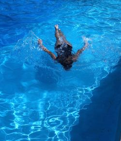 High angle view of woman swimming in pool