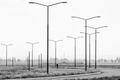 Street light on field against sky