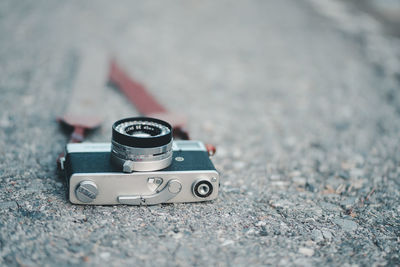 Close-up of camera on footpath