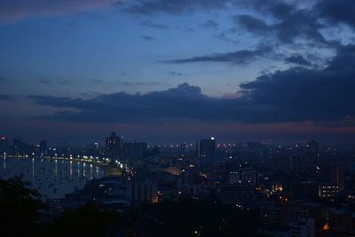 High angle view of illuminated buildings in city at night
