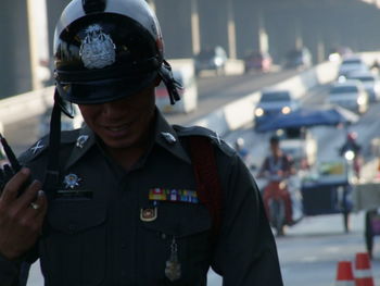 Close-up of senior man standing in shopping mall