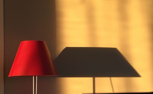 Close-up of electric lamp at home